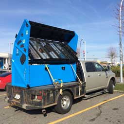 Topsoil screener is transportable on a flatbed truck or trailer.